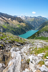 Fototapeta na wymiar Beautiful alpine walley with azure blue water of Speicher Zillergrundl dam, Zillertal Alps, Austria