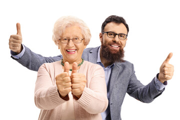 Cheerful bearded man standing behind an elderly woman and showing thumbs up