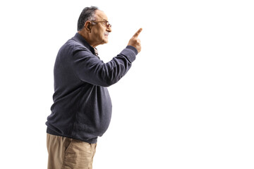 Profile shot of an angry mature man gesturing with finger