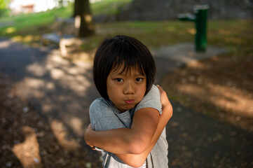 portrait of an Asian girl was mad and with both hands Crossed