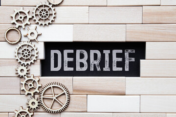 debrief word in a dictionary. debrief concept