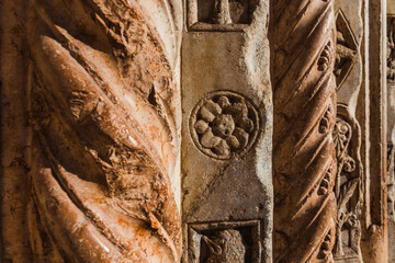 Detail of the engravings in the rock of the columns of the Duomo of Verona, ancient symbols of craftsmen.