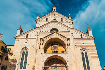 Fototapeta na wymiar Main facade of the Verona Cathedral, illuminated by the sun.