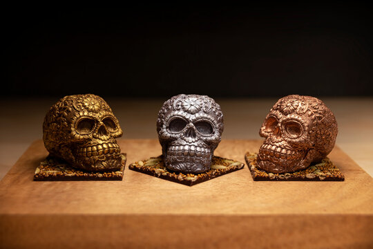 edible ornamented mexican skull made of chocolate gourmet, traditional gift for "dia de muertos" day of the death in Mexico culture named "calaverita de azucar" or "calaverita de chocolate"