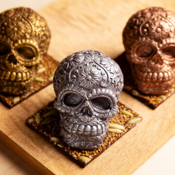 edible ornamented mexican skull made of chocolate gourmet, traditional gift for "dia de muertos" day of the death in Mexico culture named "calaverita de azucar" or "calaverita de chocolate"