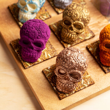 edible ornamented mexican skull made of chocolate gourmet, traditional gift for "dia de muertos" day of the death in Mexico culture named "calaverita de azucar" or "calaverita de chocolate"