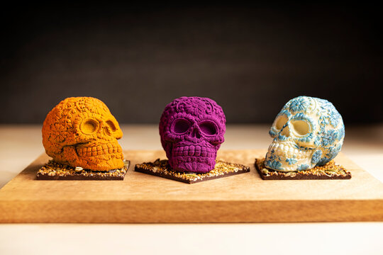 set of edible ornamented mexican skulls made of chocolate, traditional gift for "dia de muertos" day of the death in Mexico culture named "calaverita de azucar" or "calaveritas de chocolate"