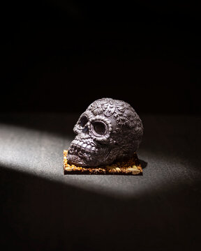 ornamented mexican skull made of chocolate gourmet, traditional gift for "dia de muertos" day of the death in Mexico culture named "calaverita de azucar" or "calaverita de chocolate"