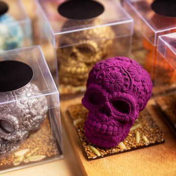 edible ornamented mexican skulls made of chocolate, traditional gift for "dia de muertos" day of the death in Mexico culture named "calaverita de azucar" or "calaveritas de chocolate"