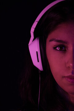 Latina listening to music with headphones