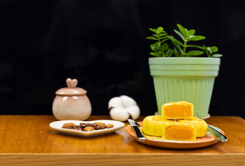 Moon cake with pretty background, a traditional food, cuisine, or snack for Chinese or Asian  Mid-Autumn festival 