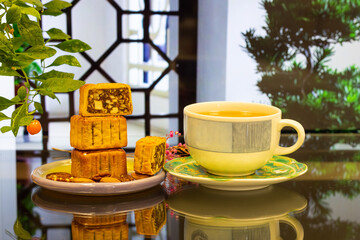 Moon cake with pretty background, a traditional food, cuisine, or snack for Chinese or Asian  Mid-Autumn festival 