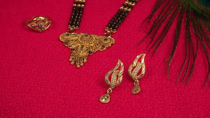 Mangalsutra or Golden Necklace to wear by a married hindu women, arranged with beautiful backgrond. Indian Traditional Jewellery.