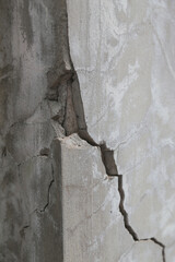 Broken concrete pole. Cause damage and dangerous to house. Concept of destruction of infrastructure.