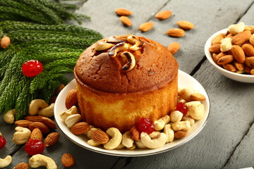 Delicious dry fruits and nuts cake on a rustic wooden background.