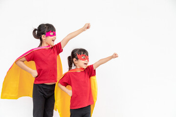 Two girls in a superhero costume on white background