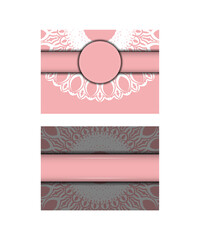 A pink brochure with a mandala in white ornamentation is ready for printing.