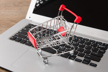 Online shopping concept. shopping cart on laptop