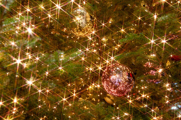 Glittering illuminated Christmas tree ornaments