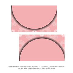 Pink business card with luxurious white ornaments for your contacts.