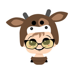 Naklejka premium Boy with big eyes, glasses and wide happy smile in a cow hat. Head of cute child with joyful face in carnival costume for holiday, Christmas or New year