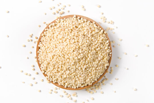 grain sorghum seed rice  in a plate isolated on white background. 