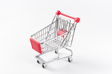 A Empty grocery shopping cart. Isolated on white background