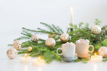 two cups of coffee with  marshmallow and christmas fir branches