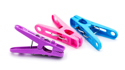 Colorful plastic clothespins or clothes pegs isolated on white background