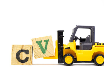 Toy forklift hold letter block V to complete word CV (Abbreviation of curriculum vitae) on wood background
