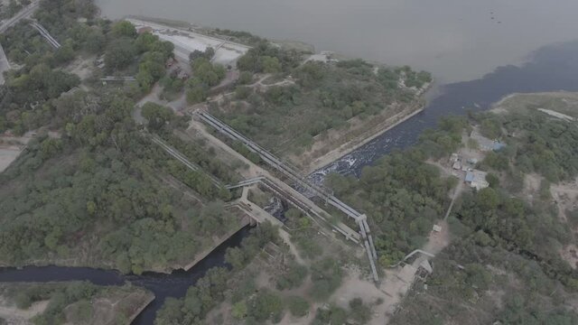 An aerial shot of water flowing past the Karnal bypass in New Delhi, India

