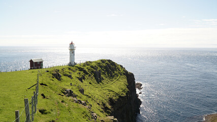 Akraberg lighthouse on Suðuroy Island in the Faroe Islands of Denmark. - obrazy, fototapety, plakaty