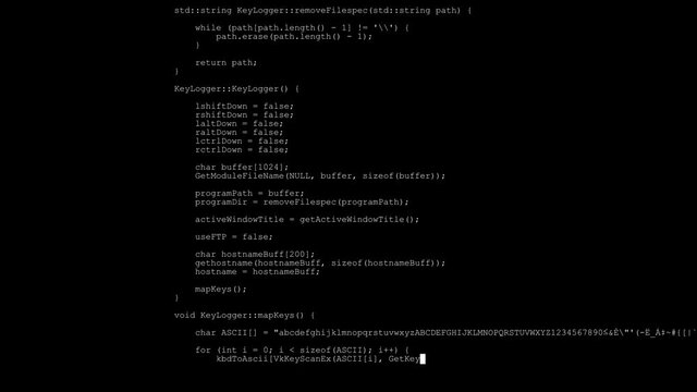 Writing program code. White lines of code appear on a black background.