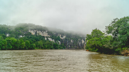 Batu Dinding, iconic landscape of limestone wall on the upper Mahakam riverbank. Beautiful landscape of karst on the riverbank
