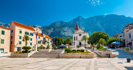 Saint Marko cathedral and church at Makarska city, Croatia. The Biokovo mountains in the...