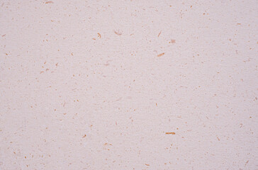 A dense industrial sheet of grey paper with a textured surface