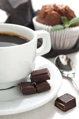 Morning coffee with chocolate muffins on the white background
