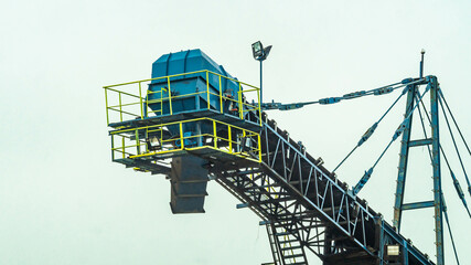 Huge conveyor at Mahakam Riverbank used to load coal to the barge. Industrial and mining background