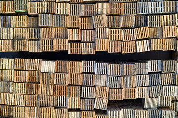 Aerial top-down view blocks of the wooden pallet in a factory