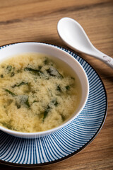 close up of a traditional Japanese soup with soy, hondashi, tofu, chives