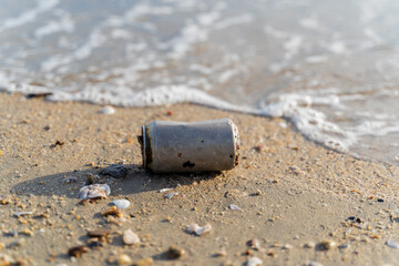 Old rusty Beverage can left on the beach, elective focus, Horizontal orientation, copy space,...