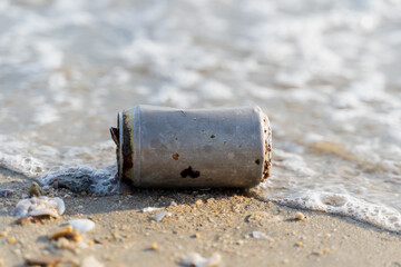 Old rusty Beverage can left on the beach, elective focus, Horizontal orientation, copy space,...