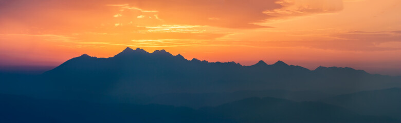 Fototapeta na wymiar Dark mountain peaks in the setting sun, Tatra Mountains, Poland