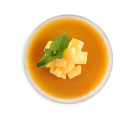 Delicious mango coulis with fresh fruit pieces and mint isolated on white