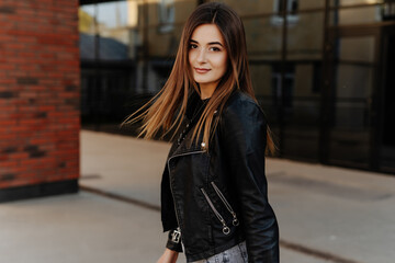 Close up portrait of cheerful pretty young woman in glamour stylish casual outfit posing walking...