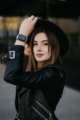 Young pretty woman posing outdoors in the street