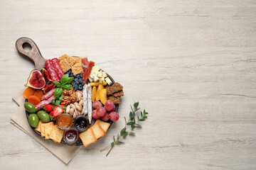 Different tasty appetizers on wooden table, flat lay. Space for text