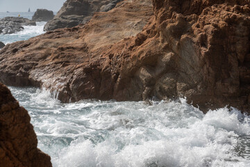 waves breaking on rocks