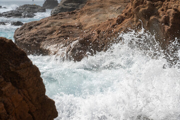 waves crashing on rocks
