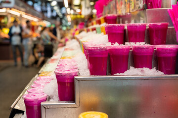 colorful cocktails with blurred market background